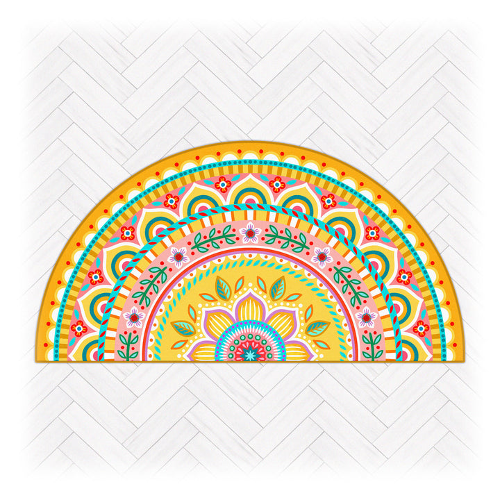 Superweiche Kuschelmatte im Design von Bine Brändle in halbrunder Form mit farbenfrohem Mandala-Bogen in Gelb, Türkis, Rosa und Rot, dekorativ und freundlich gestaltet.